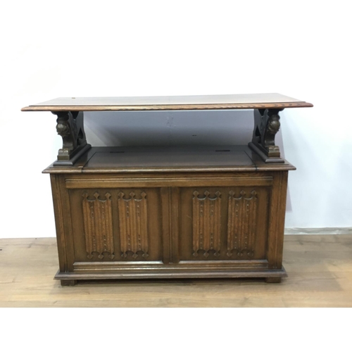 412A - A reproduction linenfold Monk's Bench with folding top