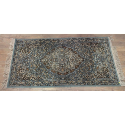 452 - A large cream and brown ground Rug with multiple square and rectangular geometric patterns, 94 x 54 ... 