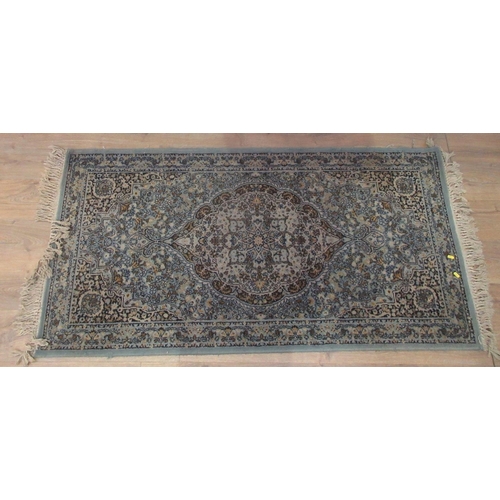 452 - A large cream and brown ground Rug with multiple square and rectangular geometric patterns, 94 x 54 ... 