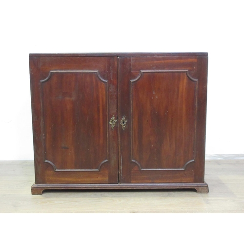 463 - A 19th Century mahogany Cupboard fitted pair of  panelled doors enclosing shelves converted to pigeo... 