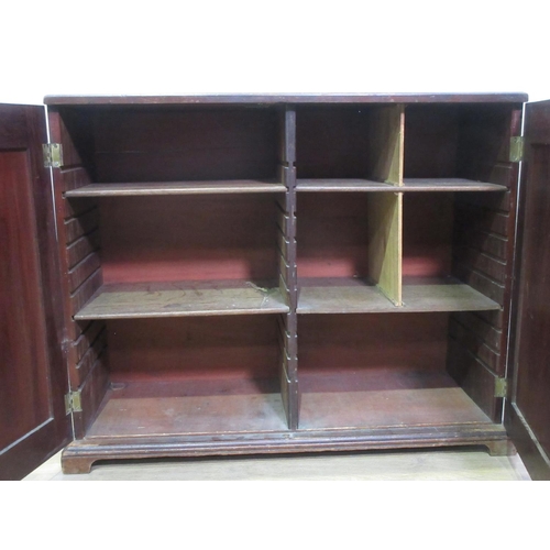 463 - A 19th Century mahogany Cupboard fitted pair of  panelled doors enclosing shelves converted to pigeo... 