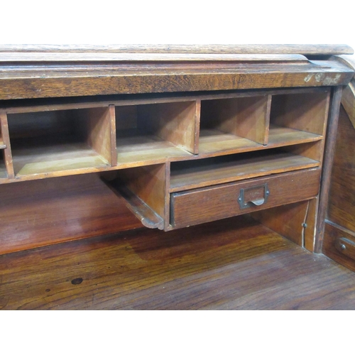 502 - An oak tambour fronted Desk fitted seven drawers 4ft 4in W x 3ft 8in H