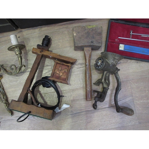 509 - Two boxes including gilt metal Wall Lights, oak Table Lamp, Tins, Meat Grinder, wooden Mallet, cased... 