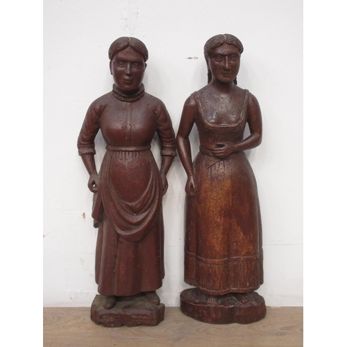 515 - Two antique carved Figures of peasant women in 17th Century dress 1ft 11in and 1ft 10in H, possibly ... 