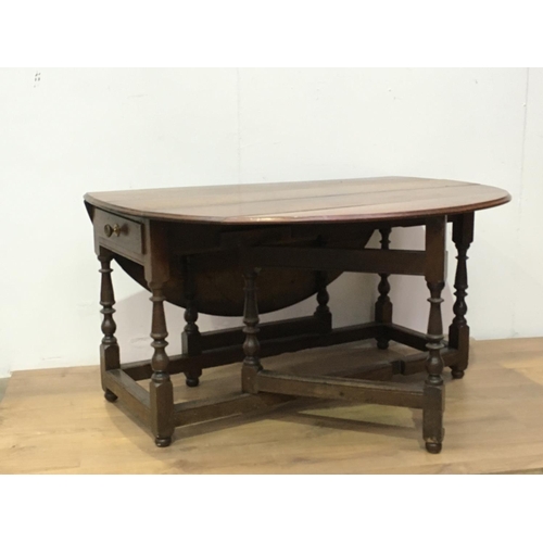 518 - An early 18th Century oak Gateleg Dining Table fitted single end drawer mounted upon baluster turned... 