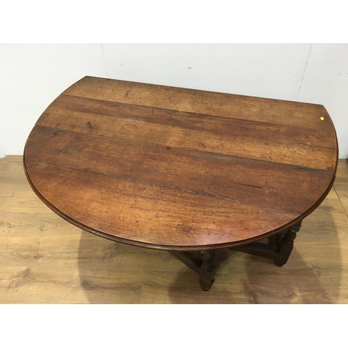 518 - An early 18th Century oak Gateleg Dining Table fitted single end drawer mounted upon baluster turned... 