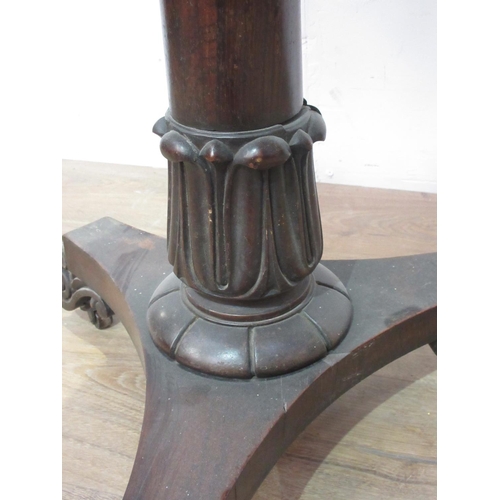 566A - A 9th Century rosewood Pillar table with carved and turned column and triform base, 1ft 9in diam