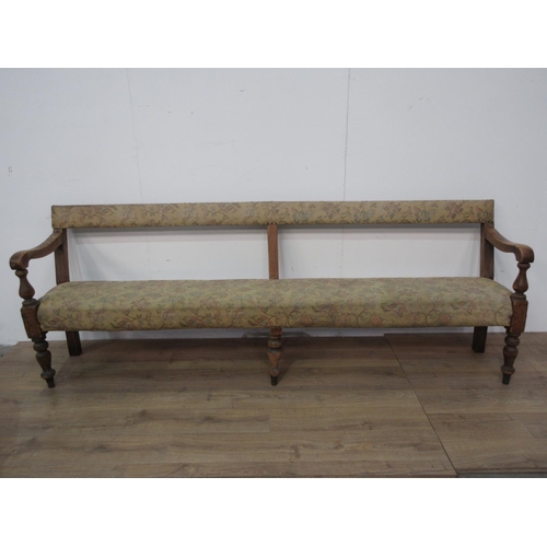 744 - A 19th Century pine Club Settle with upholstered back and seat mounted on turned front supports A/F ... 