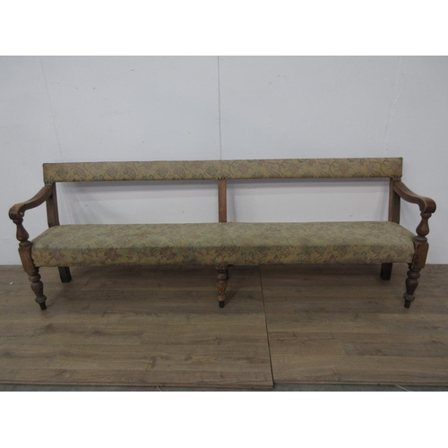 745 - A 19th Century pine Club Settle with upholstered back and seat mounted on turned front supports A/F ... 