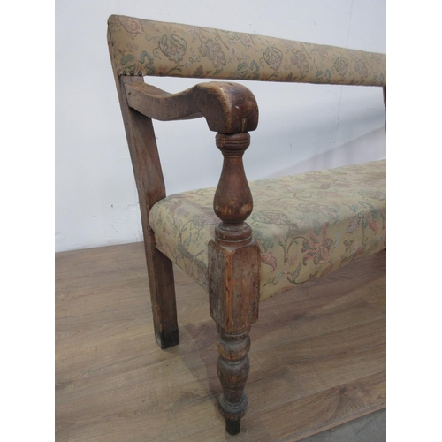 745 - A 19th Century pine Club Settle with upholstered back and seat mounted on turned front supports A/F ... 