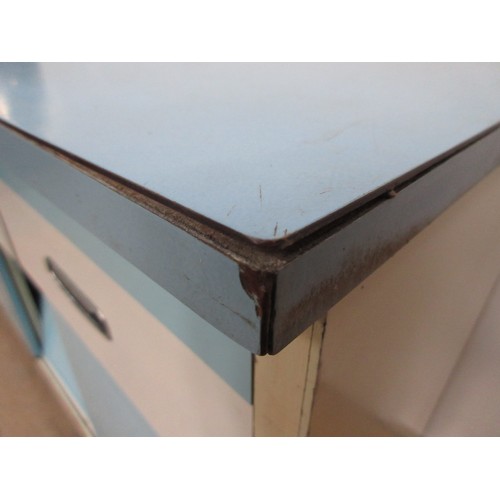 104 - A post-war blue and white formica veneered Kitchen Cabinet fitted three drawers above three sliding ... 