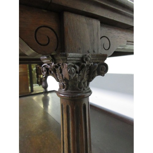 446 - A 19th Century oak Buffet with leafage carved corinthian column supports above base fitted three dee... 