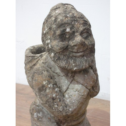 487 - A composite stone garden Gnome 1ft 9in, another lying down and a terracotta roof Tile