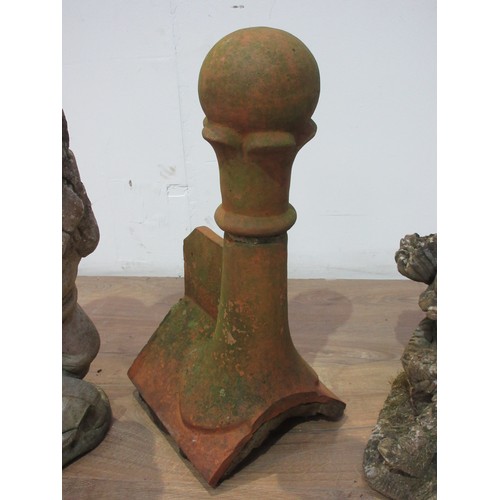 487 - A composite stone garden Gnome 1ft 9in, another lying down and a terracotta roof Tile