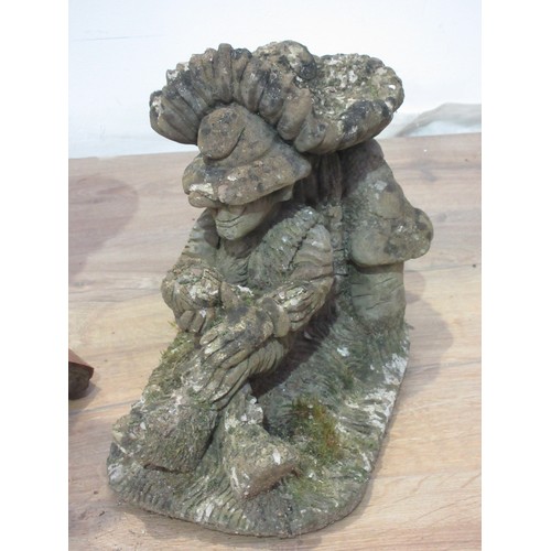 487 - A composite stone garden Gnome 1ft 9in, another lying down and a terracotta roof Tile