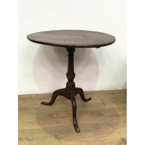 539 - A 19th Century oak tilt-top Table with turned column and tripod base, 2ft 2in diam