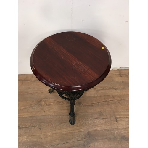 564 - A Victorian circular Pub table the cast base with ram's head design, 2ft diam