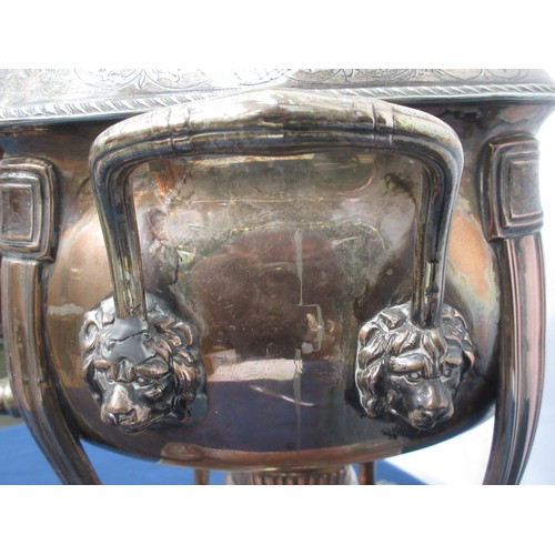 506 - A Regency silver plated Samovar with leafage engraved frieze and two lion mask handles mounted upon ... 