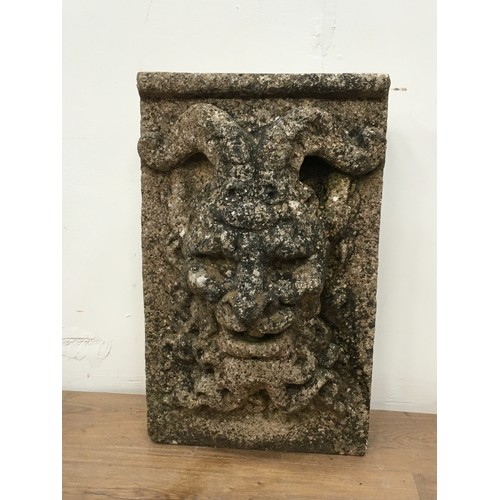 750 - A cast stone Water Spout in the form of a Man with Rams' Horns 1ft 10in H  Amendment CAST not carved