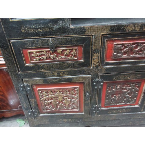 752 - An antique Chinese chinoisserie black lacquered Cabinet with beast and fruiting grape pierced frieze... 