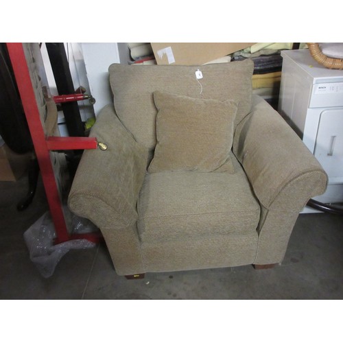 569 - A beige upholstered Armchair with herringbone design