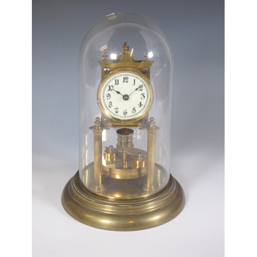 476 - A brass Perpetual Motion Mantel Clock under glass dome 1ft H and a bronze effect Figure of a Pony an... 