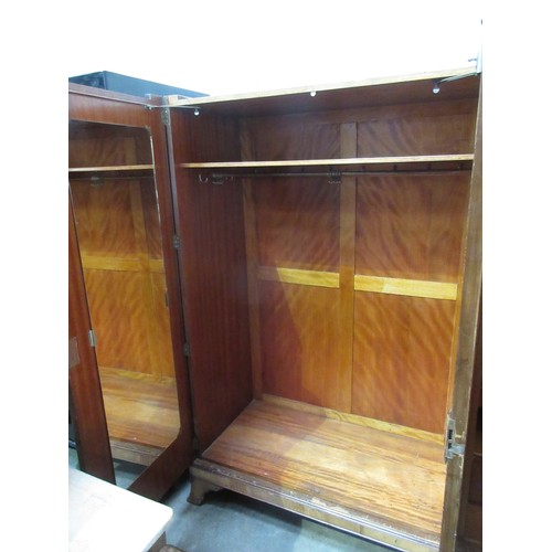 336 - An Art Deco figured walnut three door Wardrobe fitted drawers and slides to the one section, 6ft 2in... 