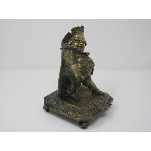 554 - A late 19th Century brass Inkwell in the form of a rotund Tudor period gentleman dressed in robes wi... 