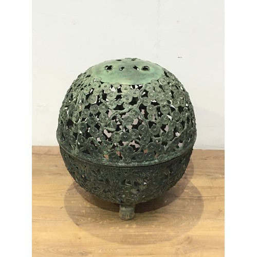 558 - A Japanese cast metal globe lantern shade with pierced trailing branch, leafage and blossom design o... 