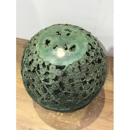 558 - A Japanese cast metal globe lantern shade with pierced trailing branch, leafage and blossom design o... 