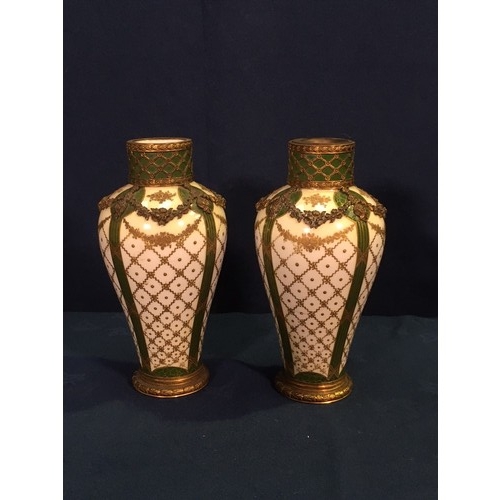 493 - A pair of Sevres Vases on cream ground with gilt lattice decoration and brass overlayed latticework ... 