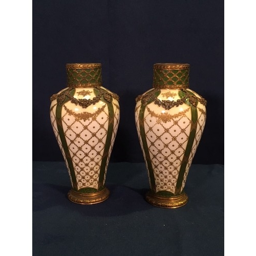 493 - A pair of Sevres Vases on cream ground with gilt lattice decoration and brass overlayed latticework ... 