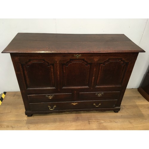 774 - An 18th Century oak Mule Chest with hinged lid above crossbanded frieze and three shaped panels, two... 