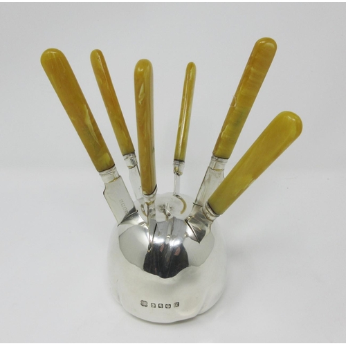 123 - An Elizabeth II silver model of an apple, Edinburgh 1953, with six plated Fruit Knives.