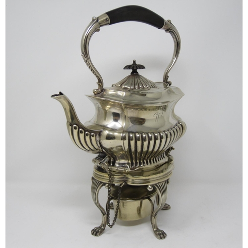 143 - An EPNS Tea Kettle of shaped oval semi-fluted form on reeded scroll supports and paw feet, with spir... 