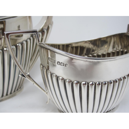 146 - A Victorian silver oval semi-fluted three piece Tea Service, Sheffield 1897/8, maker: J. Dixon & Son... 