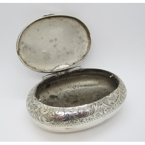 172 - An Edward VII silver oval Tobacco Box with floral scroll engraving and initials, Birmingham 1906.