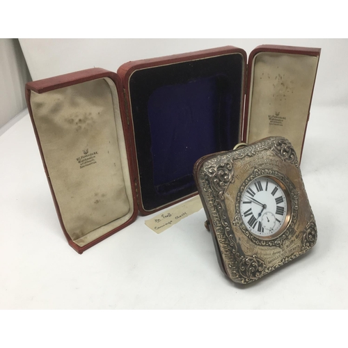 181 - A Victorian silver mounted Travelling Clock Case with scroll embossing and presentation inscription,... 