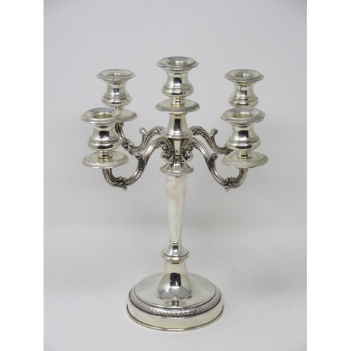 214 - A Greek silver four branch five light Candle Holder on tapering column and circular base