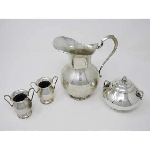 215 - A Greek silver baluster Jug with pair of small two handled Vases and a lidded Sucrier