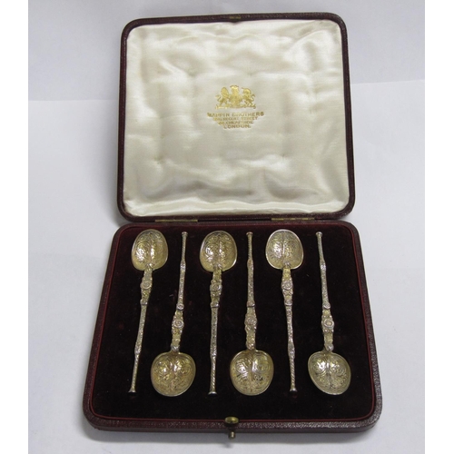 224 - Six Edward VII silver-gilt Teaspoons in the form of early anointing spoons, London 1902, in case.