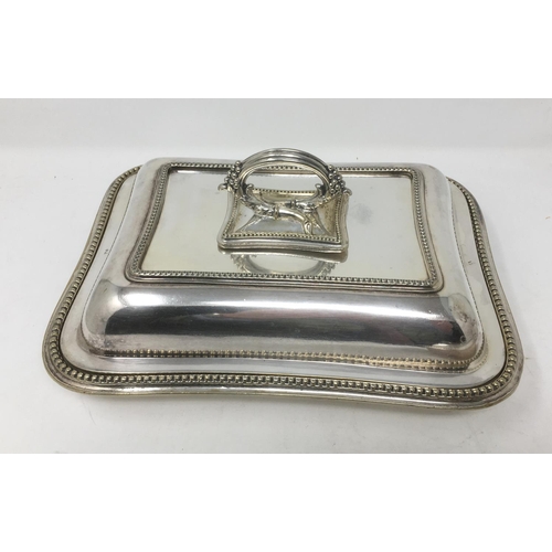 235 - A pair of plated oblong Entree Dishes and Covers with central handles and beaded rims, 10 x 8in.