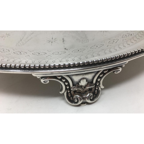 237 - A Victorian silver circular Salver with floral swag engraving, presentation inscription, beaded rim ... 