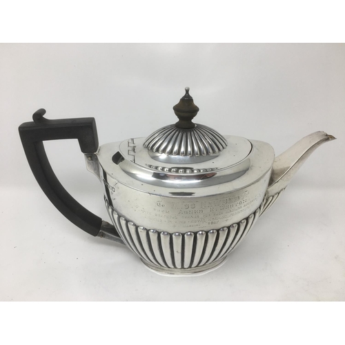 240 - A Victorian silver matched three piece Tea Service of oval semi-fluted form, the teapot with inscrip... 