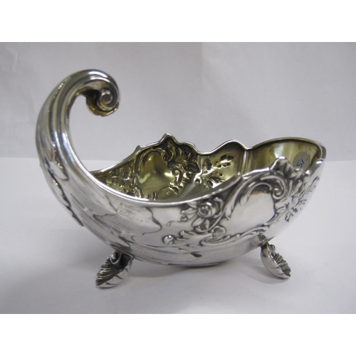 246 - A Continental silver Bowl in the form of a nautilus shell with floral scroll embossing on three scal... 