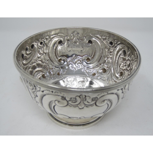 254 - A Victorian silver circular Bowl with floral scroll embossing and vacant cartouche, Birmingham 1897,... 