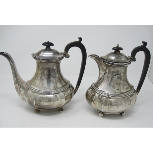 256 - A George V silver Coffee Pot and Hot Water Jug of shaped oval form, presentation inscriptions ebonis... 