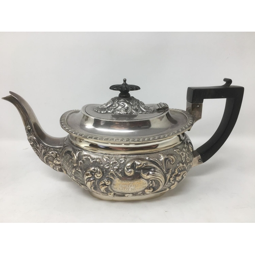 278 - A Victorian/Edward VII silver four piece Tea Service of boat shape with floral and scroll embossing,... 