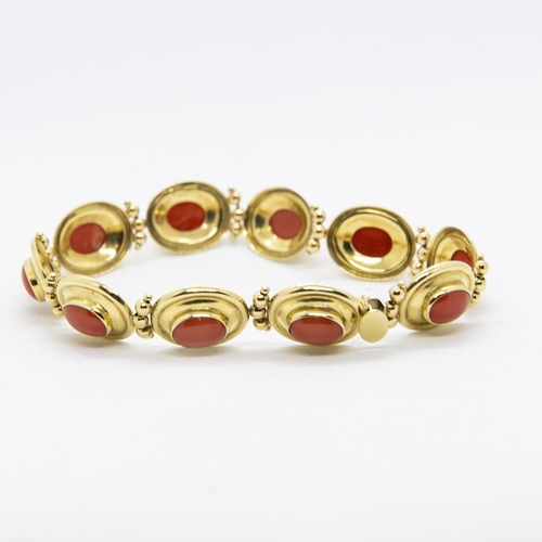 306 - A Coral Bracelet having oval links each set oval cabochon on hidden clasp, approx 16.90gms.