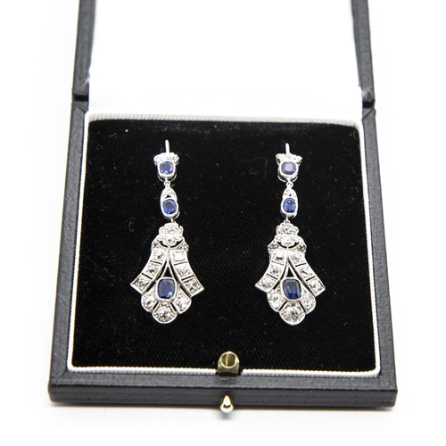 326 - A pair of Sapphire and Diamond Ear Pendants, each millegrain-set two cushion-cut sapphires suspendin... 